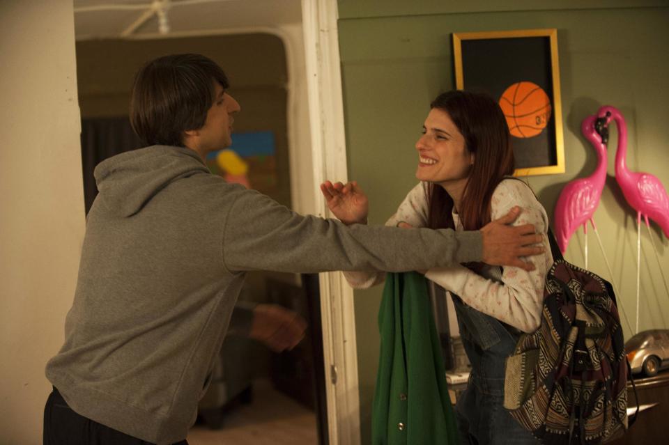 This publicity photo released by Roadside Attractions shows, Demetri Martin, left, and Lake Bell, in a scene from the film "In a World...," a comedy about a struggling voice coach. Written and directed by Bell, who also stars in the film, it won the Sundance 2013 Waldo Salt Screenwriting Award for the script. Real voice-over artists, the men and women who’ve spent years invisibly announcing the latest Taco Bell temptation, the promise of Firestone tires or upcoming Lifetime programs, who’ve seen the film (which expands to more than 30 locations Aug. 16, 2013) say it’s great to watch their profession on screen. (AP Photo/Roadside Attractions, Bonnie Osborne)