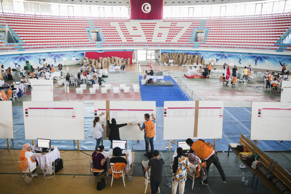 Members of the Independent Higher Authority for Elections count the votes one day after the constitutional referendum in Tunis. Tuesday, July 26, 2022. Tunisians awaited Tuesday for the official preliminary results of a constitutional referendum held a day earlier. The proposed constitution gives the office of the president all executive powers and removes key checks and balances. (AP Photo/Hassene Dridi)