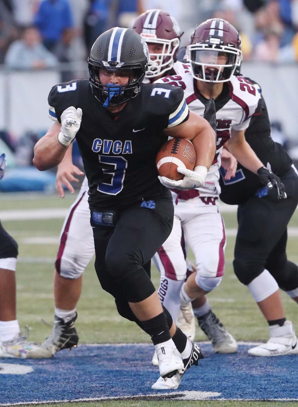 CVCA running back Kyle Snider runs for a first down during the second quarter of their game against Woodridge at CVCA Friday, Sept. 3, 2021 in Cuyahoga Falls, Ohio.