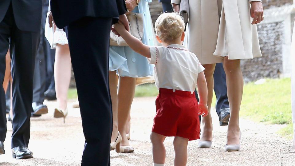 Carole Middleton smiles at Prince George as they leave the Church of St Mary Magdalene on the Sandringham Estate after the Christening of Princess Charlotte on July 5, 2015 