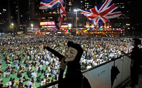 Pro-democracy protests have been raging in Hong Kong for four months - Credit: Kin Cheung/AP