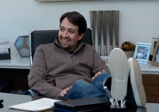 Lin-Manuel Miranda smiles during a meeting with Larry and Jeff in "Curb Your Enthusiasm"