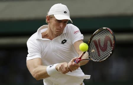 Kevin Anderson of South Africa hits a shot during his match against Novak Djokovic of Serbia at the Wimbledon Tennis Championships in London, July 7, 2015. REUTERS/Henry Browne