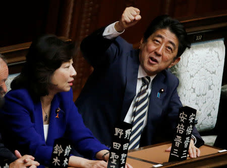 Japan's Prime Minister Shinzo Abe (R) gestures as he talks with ruling Liberal Democratic Party lawmaker Seiko Noda at the Lower House of the Parliament in Tokyo, Japan, November 1, 2017. REUTERS/Toru Hanai