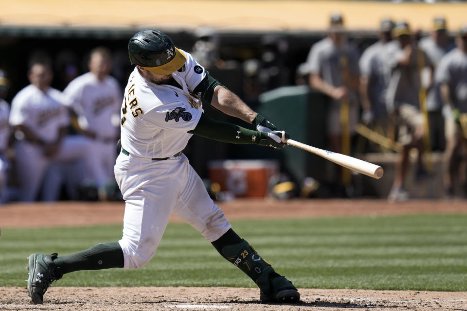 Oakland Athletics' Shea Langeliers hits a two-run single against the San Francisco Giants during the sixth inning of a baseball game Sunday, Aug. 6, 2023, in Oakland, Calif. (AP Photo/Godofredo A. Vásquez)