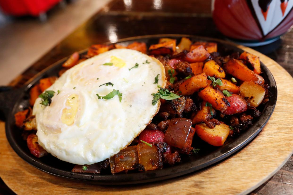 The Normaltownie skillet with sweet potato hash, chorizo, red onion, radish and two eggs at Agua Linda's new breakfast.