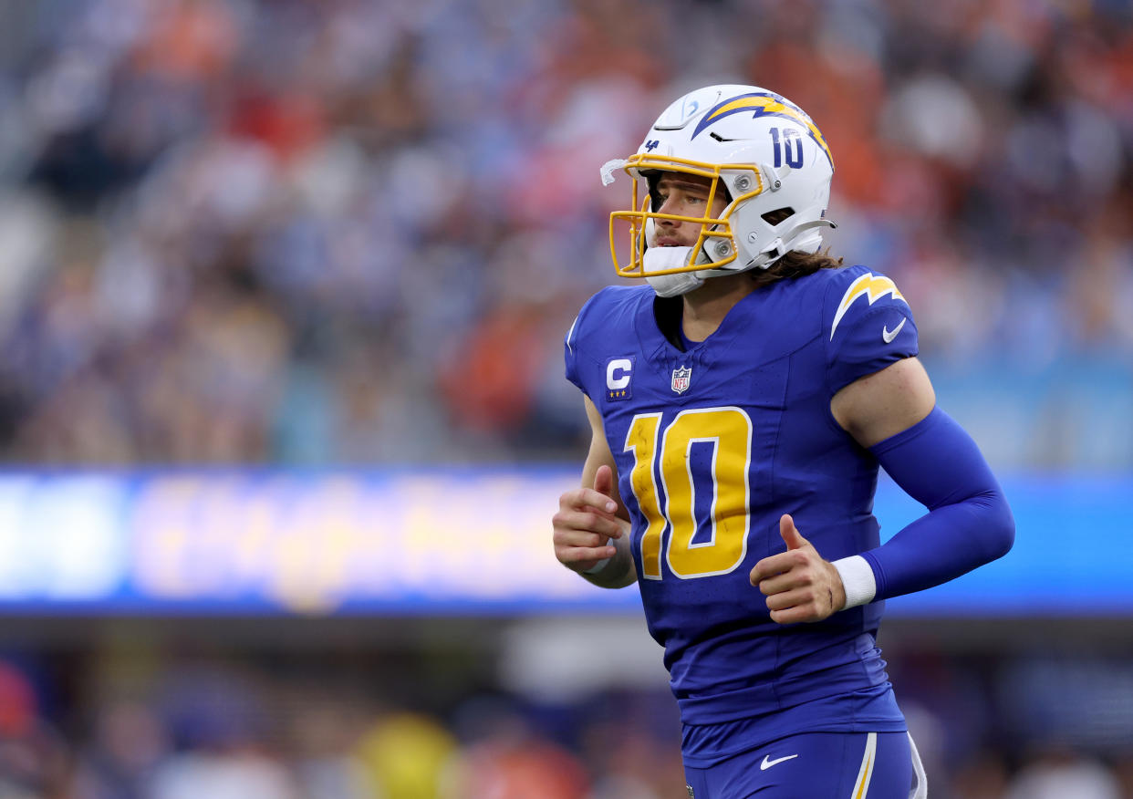 INGLEWOOD, CALIFORNIA - DECEMBER 10: Justin Herbert #10 of the Los Angeles Chargers returns to the field during a 24-7 loss to the Denver Broncos at SoFi Stadium on December 10, 2023 in Inglewood, California. (Photo by Harry How/Getty Images)