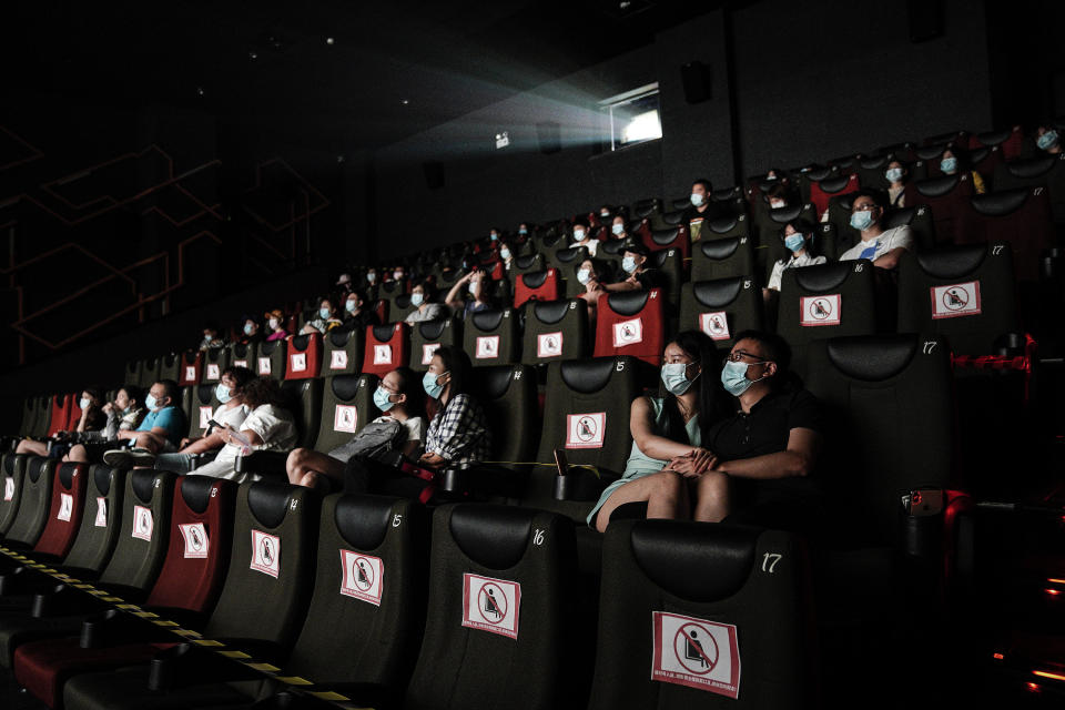 WUHAN, CHINA - JULY 20: (CHINA OUT)Residents watch a movie in a cinema in Wuhan on July 20, 2020 in Wuhan ,Hubei Province,China.Taking various measures against COVID-19, cinemas in the city reopened in an orderly manner on Monday. The China Film Administration, in a circular last week, allowed cinemas in low-risk areas to resume operation with effective epidemic prevention measures in place. (Photo by Getty Images)