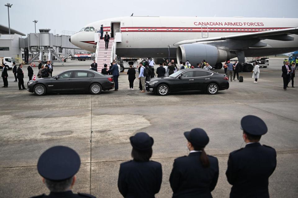 File: Justin Trudeau walks off the plane upon his arrival at Hiroshima airport in Mihara, Hiroshima to attend the G7 Leaders’ Summit (AFP via Getty Images)