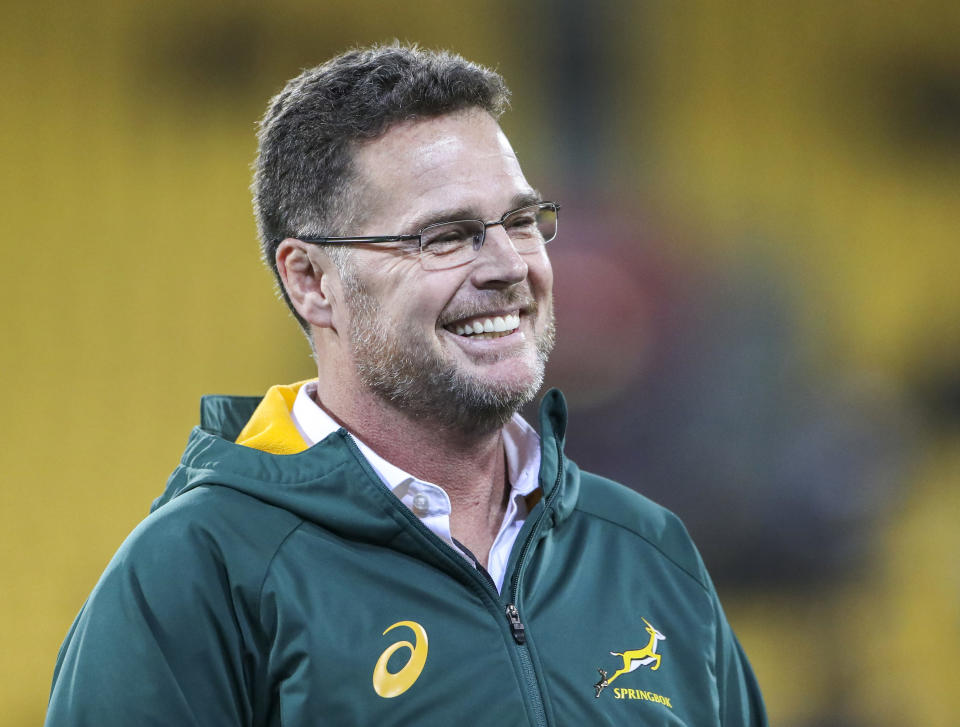 FILE - In this Saturday, Sept. 15, 2018 file photo, South Africa Rassie Erasmus smiles after the rugby championship test match between South Africa and New Zealand in Wellington, New Zealand. Springboks coach Rassie Erasmus on Wednesday July 17, 2019, has split his squad into two groups to prepare better for the challenge against the world champion All Blacks next weekend and manage fatigue ahead of the upcoming Rugby World Cup. (AP Photo/John Cowpland, File)