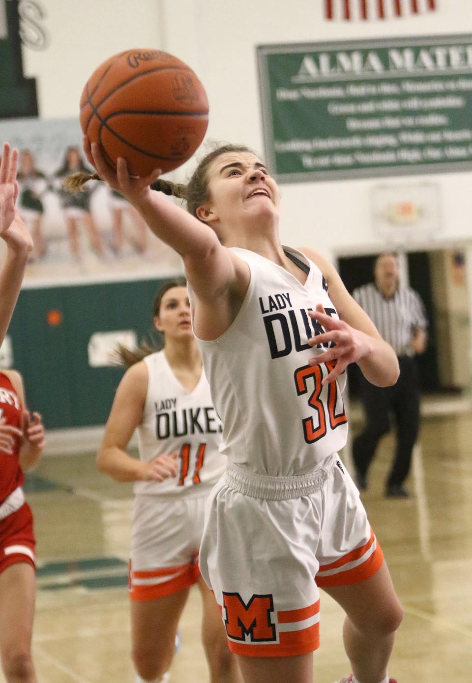 Marlington's Elizabeth Mason puts up a shot against Lake County Perry during a Division II district final, Saturday, Feb. 25, 2023, at Nordonia High School.