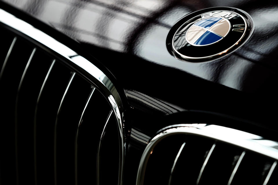 FILE - In this Wednesday, March 21, 2018 file photo, the logo of German car manufacturer BMW is pictured on a BMW 7 car prior to the earnings press conference in Munich, Germany. German automaker BMW AG lost 212 million euros, $250 million, in the second quarter as the coronavirus pandemic shutdowns cut vehicle sales by a quarter in the April-June period.(AP Photo/Matthias Schrader, File)