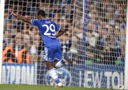 Chelsea's Samuel Eto'o celebrates after scoring a goal against FC Schalke 04 during their Champions League soccer match at Stamford Bridge in London November 6, 2013. REUTERS/Dylan Martinez (BRITAIN - Tags: SPORT SOCCER)