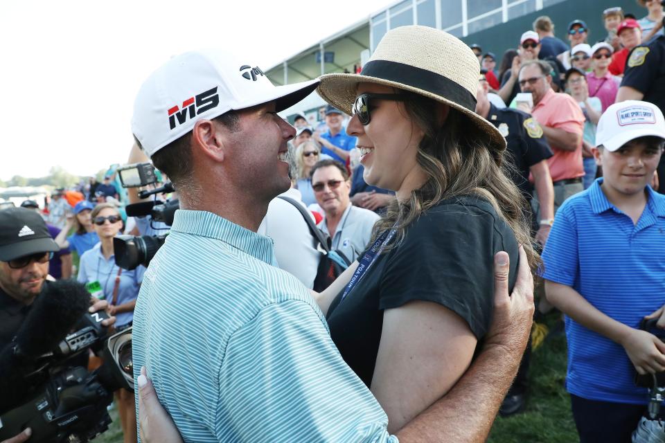 Chez Reavie celebrates with wife Amanda Henrichs after winning the 2019 Travelers Championship.