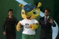 Marta and former Brazilian soccer player Bebeto (R) introduce the World Cup mascot Fuleco during the draw for the 2014 World Cup at the Costa do Sauipe resort in Sao Joao da Mata, Bahia state, December 6, 2013. REUTERS/Ricardo Moraes