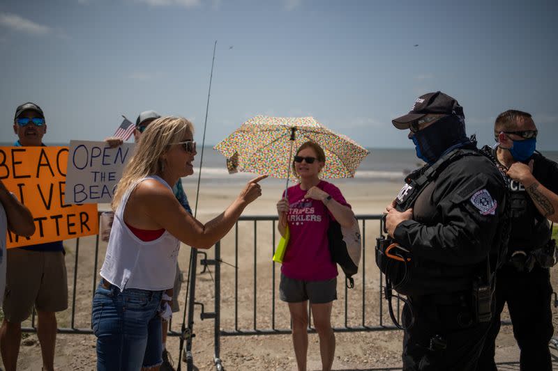 Local residents protest closed beaches on 4th of July amid the global outbreak of the coronavirus disease in Galveston, Texas