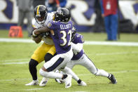 Pittsburgh Steelers wide receiver JuJu Smith-Schuster, left, is stopped short of the goal line by Baltimore Ravens free safety DeShon Elliott (32) and cornerback Marlon Humphrey during the second half of an NFL football game, Sunday, Nov. 1, 2020, in Baltimore. (AP Photo/Gail Burton)