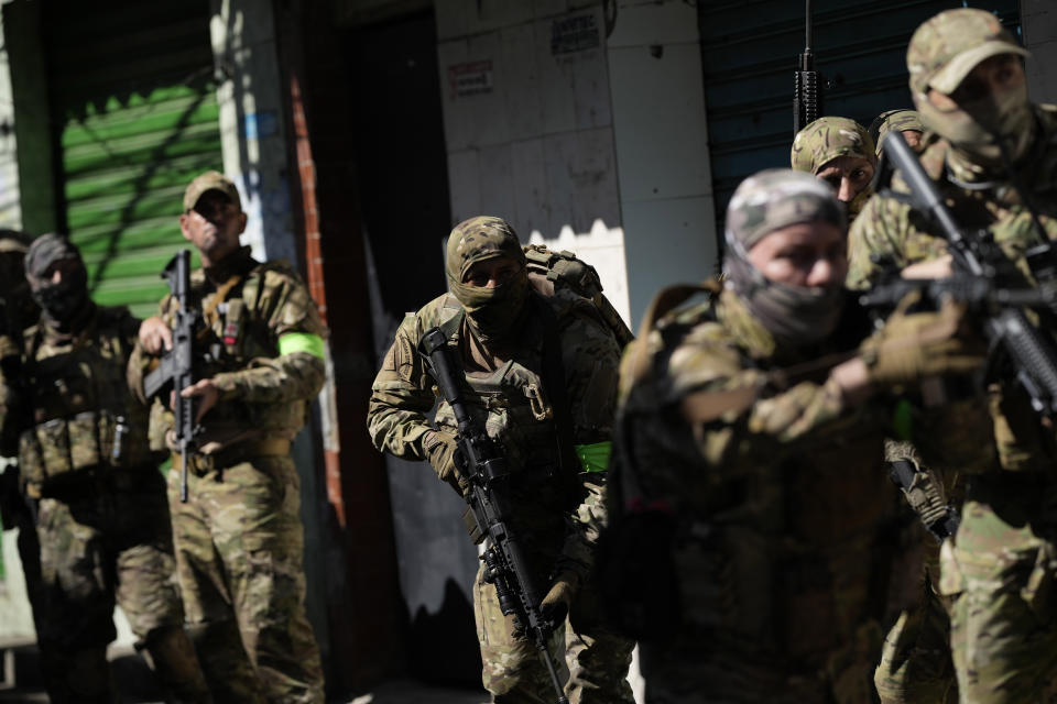 Police conduct an operation in the Complexo do Alemao favela in Rio de Janeiro, Brazil, Thursday, July 21, 2022. Multiple deaths were reported during the raid that was targeting a criminal group in Rio largest complex of favelas, or low-income communities, that stole vehicles, cargo and banks, as well as invaded nearby neighborhoods. (AP Photo/Silvia Izquierdo)