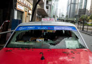 <p>Two taxis have their back windows knocked out by falling windows from an office building in Causeway Bay as Typhoon Hato hits land in Hong Kong causing a signal 10 Tropical cyclone on Aug. 23, 2017. (Photo: Jayne Russell via ZUMA Wire) </p>