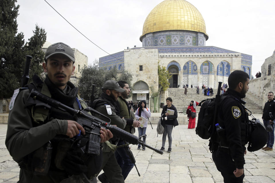 Israeli police arrests a Palestinian in front of the Dome of the Rock mosque in Jerusalem, Monday, Feb. 18, 2019. Israeli police officers have arrested several Palestinians for "causing a disturbance" at a flashpoint Jerusalem holy site. The men took part in a prayer protest Monday outside a section of the Temple Mount that has been closed by Israeli court order for over a decade. (AP Photo/Mahmoud Illean)