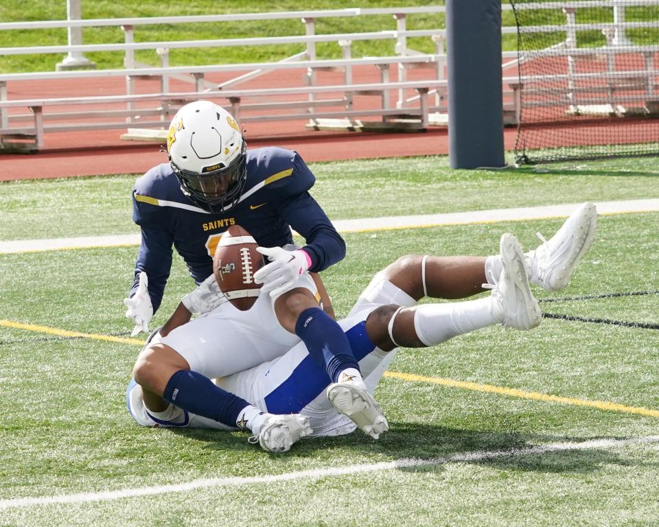 Siena Heights' Eric Williams II hauls in a touchdown pass during Saturday's game against Lawrence Tech.