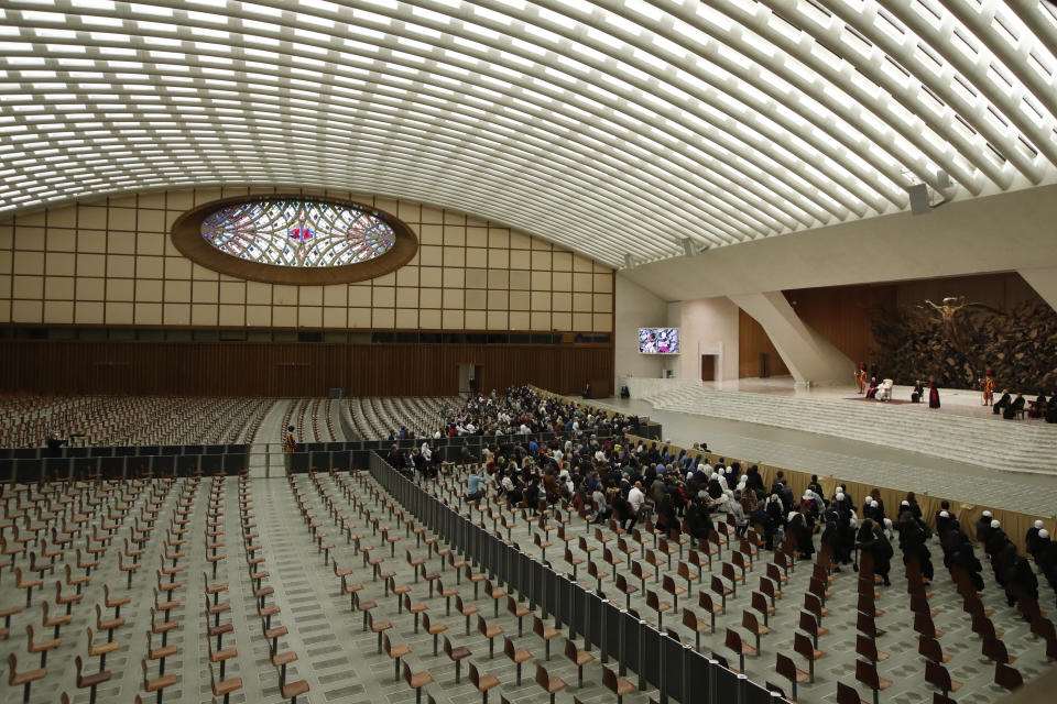 FILE - In this Wednesday, Oct. 28, 2020 file photo, Pope Francis delivers his speech in the Paul VI Hall at the Vatican for his weekly general audience. The Vatican is putting an end to Pope Francis’ general audiences with the public amid a surge in coronavirus cases in Italy and a confirmed infection at last week’s encounter. The Vatican said Thursday that Francis would resume livestreaming his weekly catechism lessons from his library in the Apostolic Palace, as he did during the Vatican’s COVID-19 lockdown over the spring and summer.(AP Photo/Alessandra Tarantino, File)