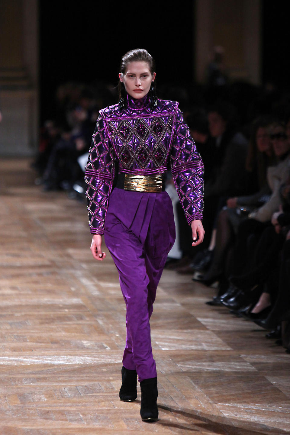 A model wears a creation by French designer Olivier Rousteing for Balmain's Fall/Winter 2013-2014 ready to wear collection in Paris, Thursday, Feb. 28, 2013. (AP Photo/Thibault Camus)