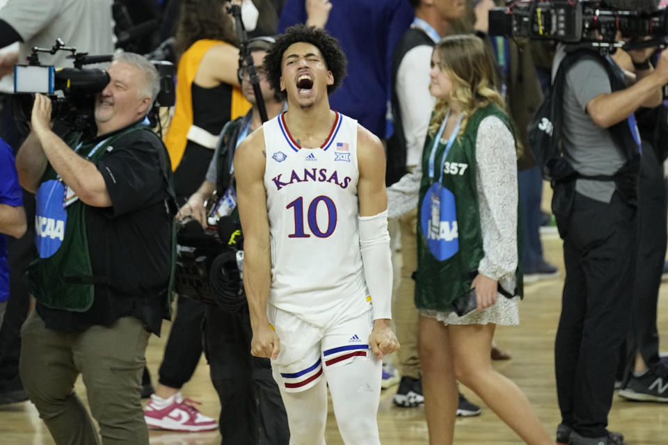 FILE - Kansas' Jalen Wilson (10) celebrates after a college basketball game against North Carolina in the finals of the Men's Final Four NCAA tournament on April 4, 2022, in New Orleans. Kansas will start off its season on Nov. 7, against Omaha. (AP Photo/Gerald Herbert, File)