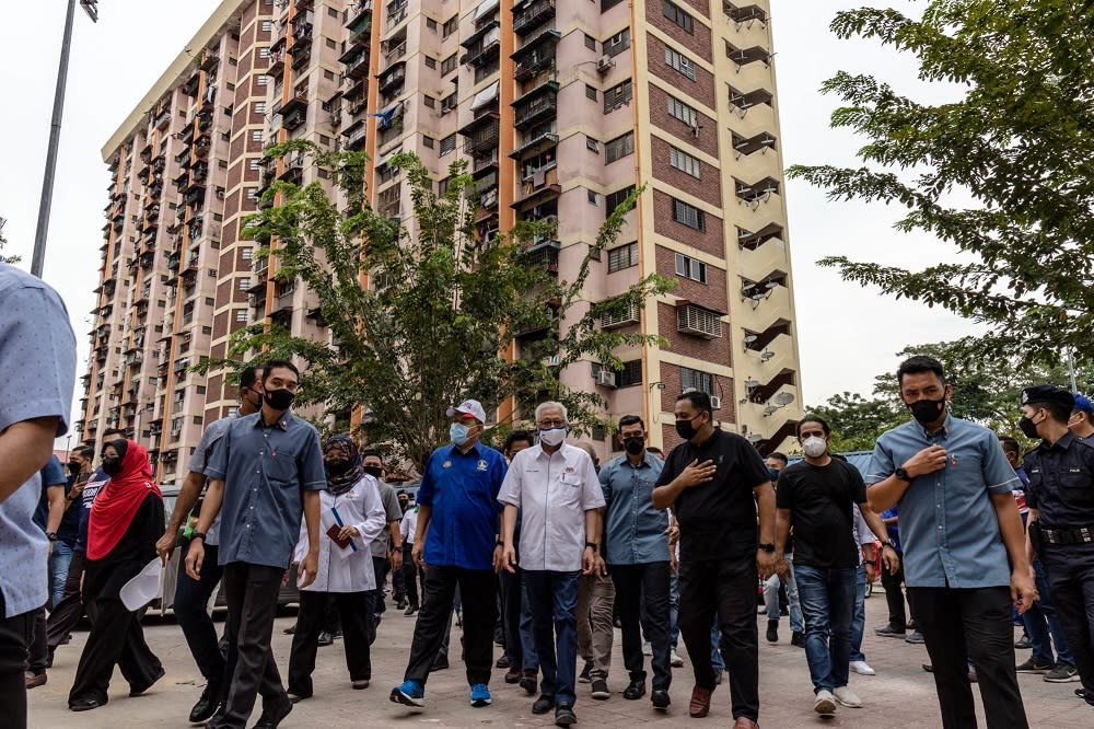 Prime Minister Datuk Seri Ismail Sabri Yaakob (centre) during a visit to the Perumahan Awam Sri Perak in Sentul October 16, 2021. — Pictures by Firdaus Latif