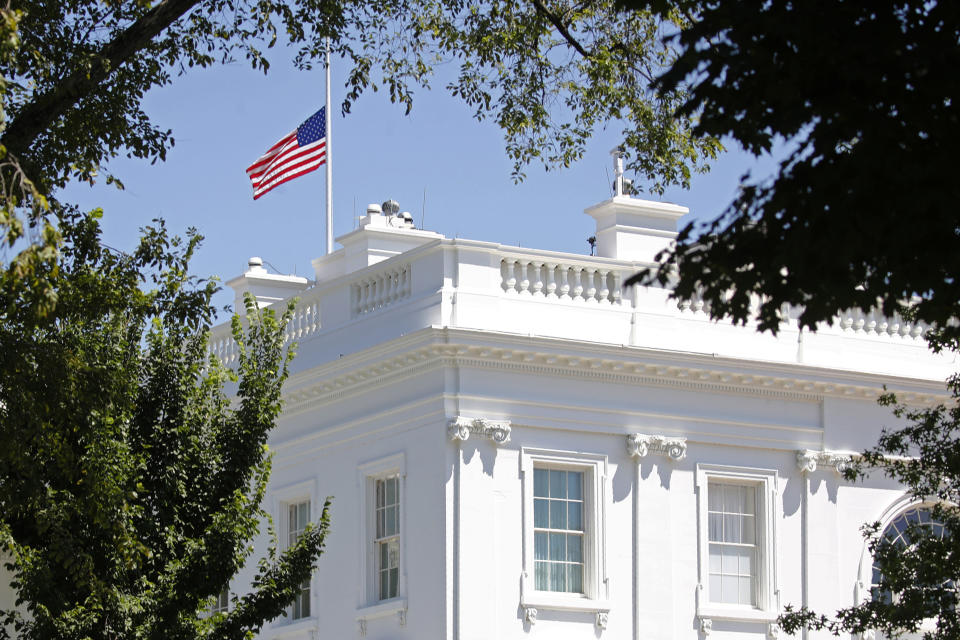 An American flag flies at half-staff over the White House in Washington, Saturday, July 18, 2020, in remembrance of Rep. John Lewis, D-Ga. Lewis, who carried the struggle against racial discrimination from Southern battlegrounds of the 1960s to the halls of Congress, died Friday. (AP Photo/Patrick Semansky)