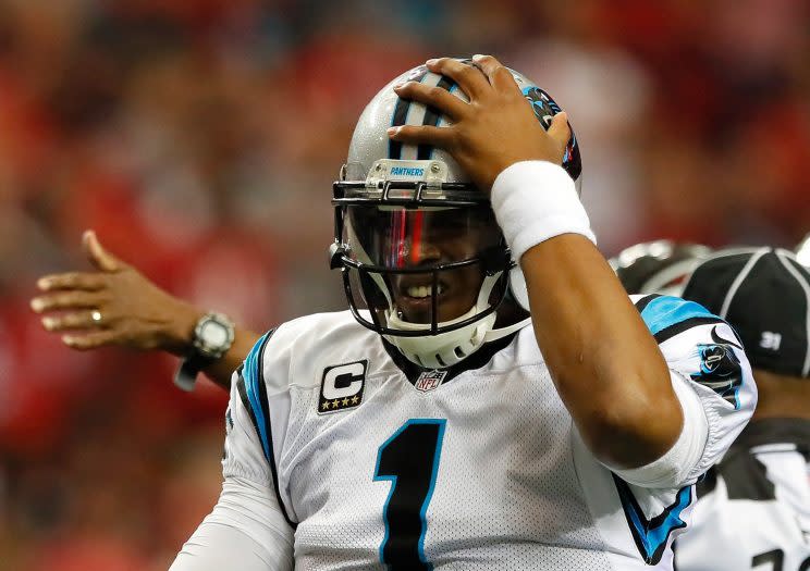 Cam Newton took another beating on Sunday, this one knocking him into the concussion protocol. (Getty Images) 