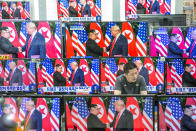 <p>Television screens in a Seoul electronics store display a news broadcast of President Trump and North Korean leader Kim Jong Un shaking hands following a document-signing event in Singapore on Tuesday. (Photo: Jean Chung/Bloomberg via Getty Images) </p>