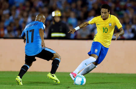 Football Soccer - Uruguay v Brazil - World Cup 2018 Qualifiers - Centenario stadium, Montevideo, Uruguay - 23/3/17 - Brazil's Neymar (10) and Uruguay's Egidio Arevalo Rios in action. REUTERS/Andres Stapff