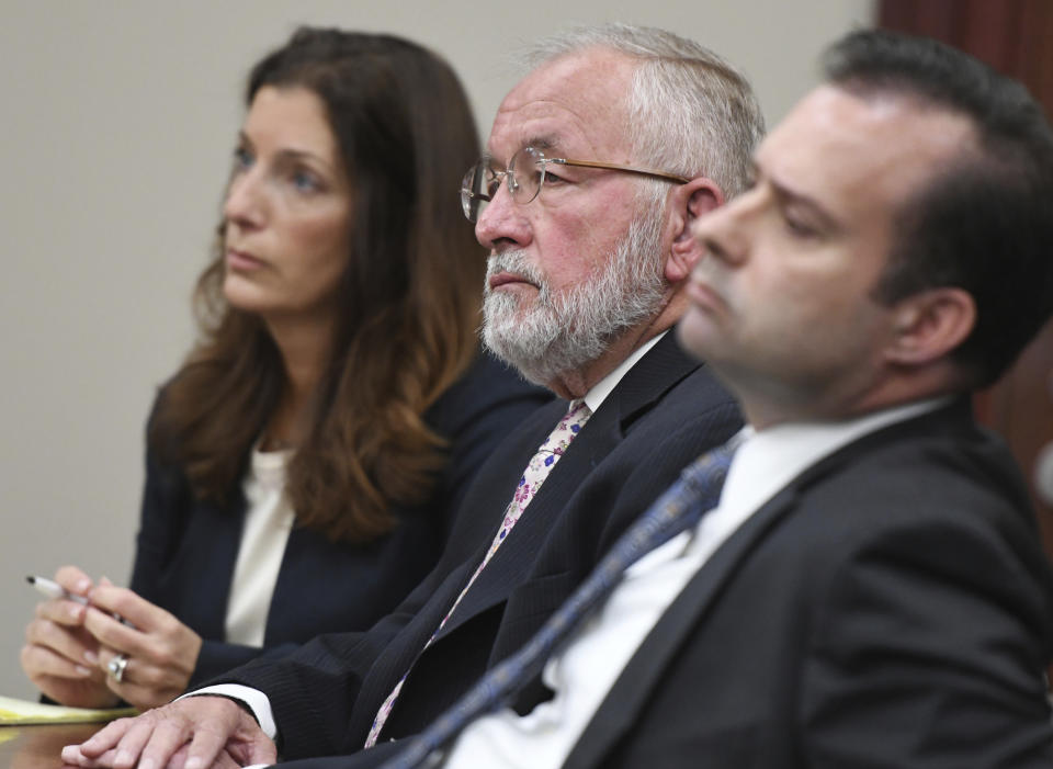 FILE - In this June 11, 2019 file photo, William Strampel, center, the ex-dean of MSU's College of Osteopathic Medicine and former boss of Larry Nassar, appears during closing arguments in his trial before Judge Joyce Draganchuk at Veterans Memorial Courthouse in Lansing, Mich. Strampel was found guilty Wednesday of neglect of duty and misconduct in office but acquitted on a more serious criminal sexual conduct charge. (J. Scott Park/Jackson Citizen Patriot via AP File)