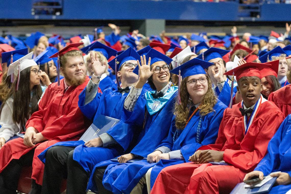 Lafayette High School graduating seniors wave at family and friends in the stands during the commencement ceremony at Rupp Arena, May 27, 2022.