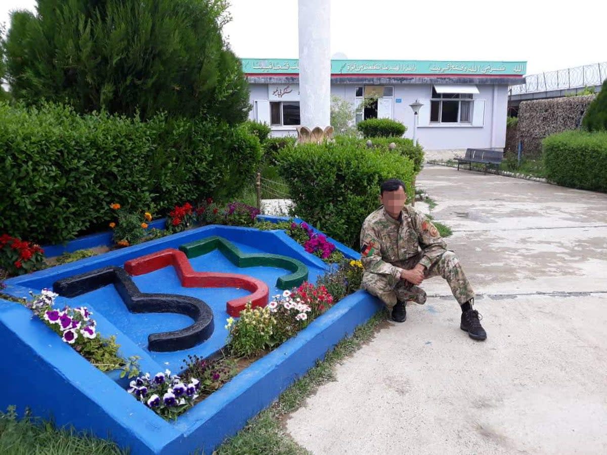 An Afghan special forces soldier next to the 333 sign at their base in Logar province, Afghanistan (Supplied)