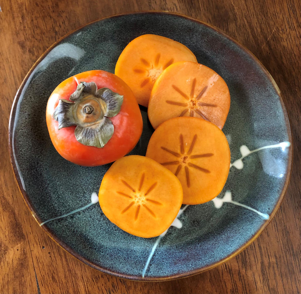 Persimmons are delicious in salads, or sliced in a grilled cheese sandwich. And the color is insane. (Heather Martin)