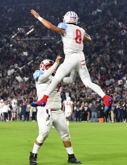 Los Angeles, California October 21, 2022-Garfield quarterback Damian Cabrera celebrates his two-point conversion.