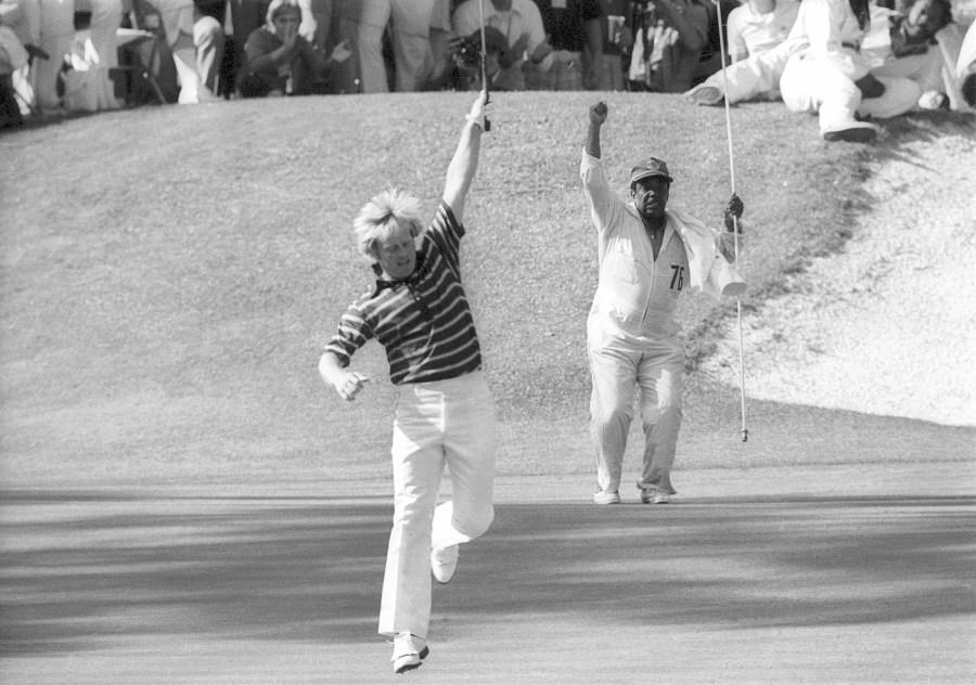 FILE – In this April 13, 1975, file photo, Jack Nicklaus, foreground, and his caddie celebrate a birdie putt on the 16th hole at Augusta National en route to Nicklaus’ unprecedented fifth Masters victory in Augusta, Ga. This Masters was voted fourth-best of all time by a panel of voters. (AP Photo/Harry Cabluck, File)