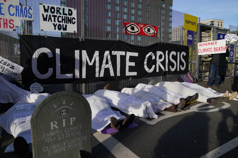 Climate activists stage a protest near the venue for the COP26 U.N. Climate Summit in Glasgow, Scotland, Thursday, Nov. 11, 2021. (Andrew Milligan/PA via AP)
