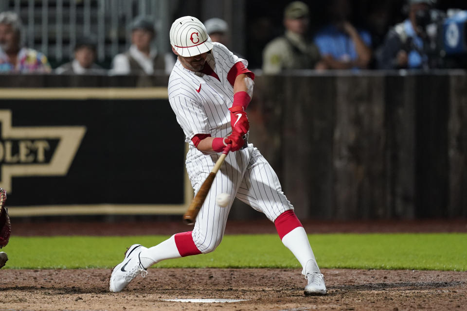 Cincinnati Reds' Matt Reynolds hits a two-run double against the Chicago Cubs in the seventh inning during a baseball game at the Field of Dreams movie site, Thursday, Aug. 11, 2022, in Dyersville, Iowa. (AP Photo/Charlie Neibergall)