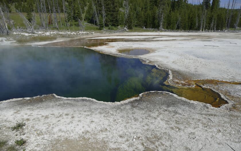 FILE - In this photo provided by the National Park Service is the Abyss Pool hot spring in the southern part of Yellowstone National Park, Wyo., in June 2015. Part of a human foot found in a shoe floating in a hot spring in Yellowstone National Park earlier this year belonged to a 70-year-old man from Los Angeles who died in July, park officials said Thursday, Nov. 17, 2022. They said they don't suspect foul play in the man's death but also didn't provide any more details. (Diane Renkin/National Park Service via AP, File)