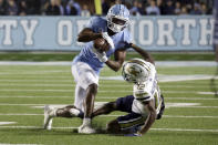 North Carolina defensive back Storm Duck (3) intercepts a pass intended for Georgia Tech wide receiver Malik Rutherford (12) during the first half of an NCAA college football game, Saturday, Nov. 19, 2022, in Chapel Hill, N.C. (AP Photo/Chris Seward)