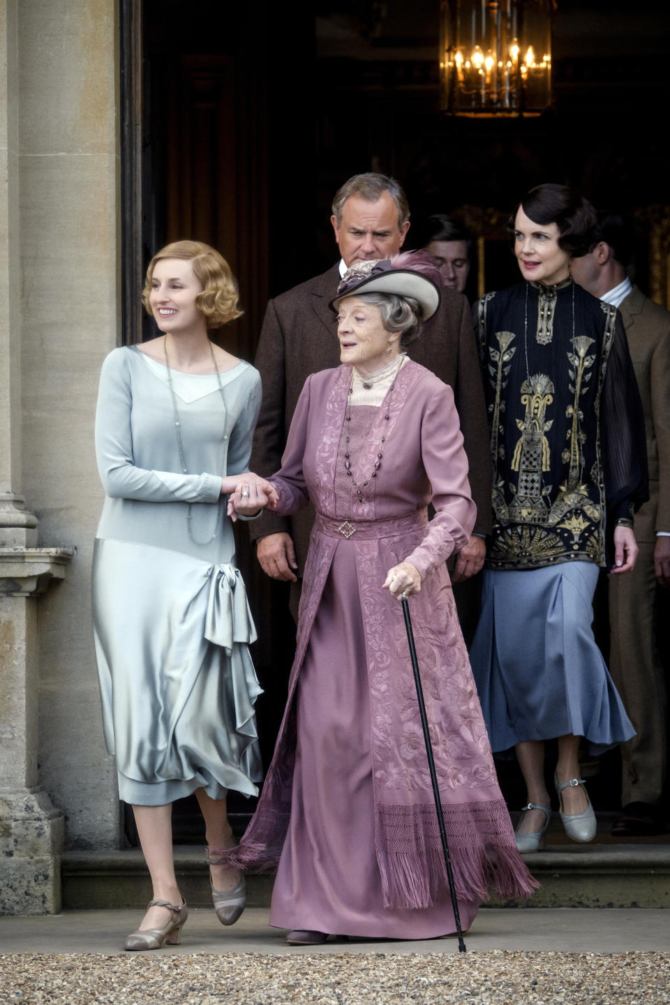 This image released by Focus features shows, from left, Laura Carmichael as Lady Hexham, Maggie Smith as The Dowager Countess of Grantham, Hugh Bonneville as Lord Grantham, Allen Leech as Tom Branson and Elizabeth McGovern as Lady Grantham in a scene from "Downton Abbey." The highly-anticipated film continuation of the "Masterpiece" series that wowed audiences for six seasons, will be released Sept. 13, 2019, in the United Kingdom and on Sept. 20 in the United States. (Jaap Buitendijk/Focus Features via AP)