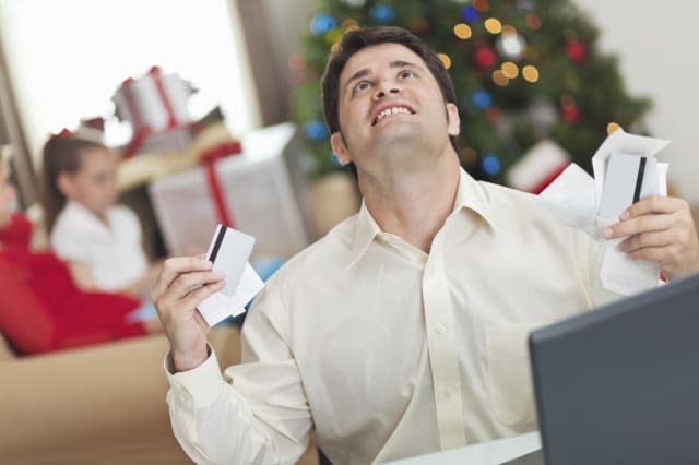 Man frustrated with his family's Christmas bills and debt.