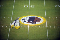 FILE - In this Aug. 28, 2009 file photo, the Washington Redskins logo is shown on the field before the start of a preseason NFL football game against the New England Patriots in Landover, Md. The Washington NFL franchise announced Monday that it will drop the “Redskins” name and Indian head logo immediately, bowing to decades of criticism that they are offensive to Native Americans. (AP Photo/Nick Wass, File)