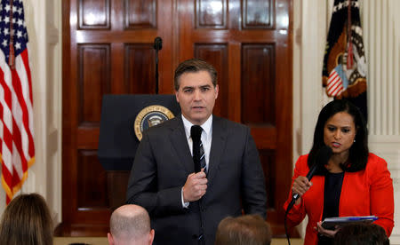 FILE PHOTO: CNN White House correspondent Jim Acosta speaks in front the camera before a news conference held by U.S. President Donald Trump in the East Room of the White House in Washington, U.S., November 7, 2018. Picture taken November 7, 2018. REUTERS/Kevin Lamarque/File Photo