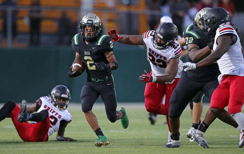 STVM running back D'Anthony Kelker, center, breaks away for a first down during the first half of a high school football game against Buchtel, Friday, Sept. 9, 2022, in Akron, Ohio.