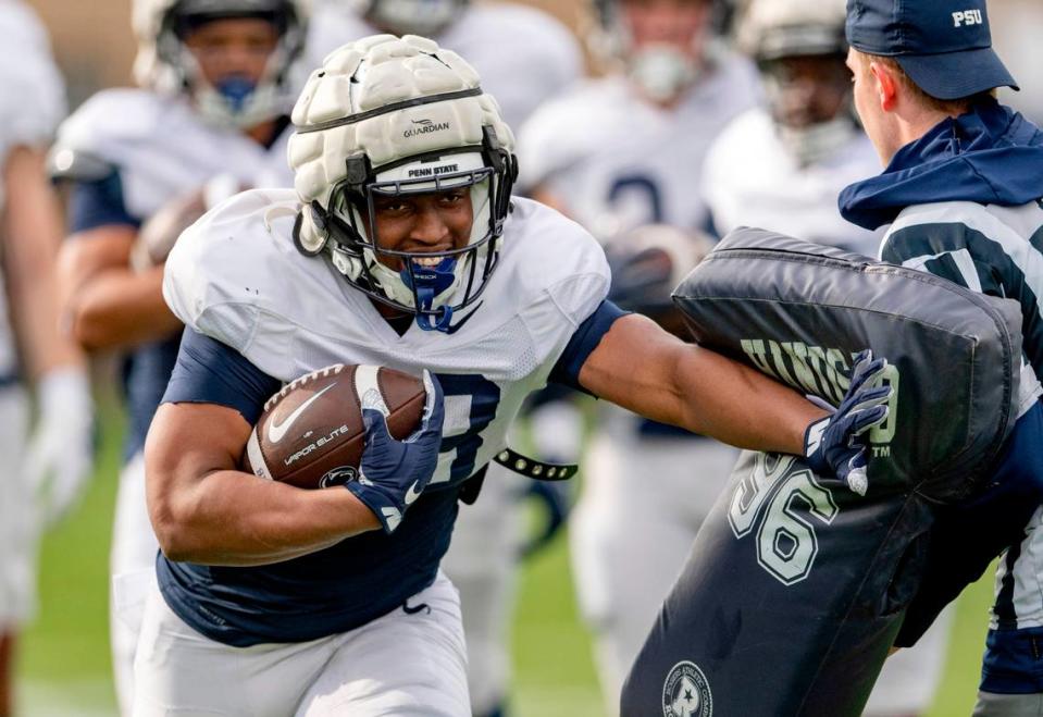 Penn State running back Kaytron Allen pushes through a drill during practice on Tuesday, April 11, 2023.