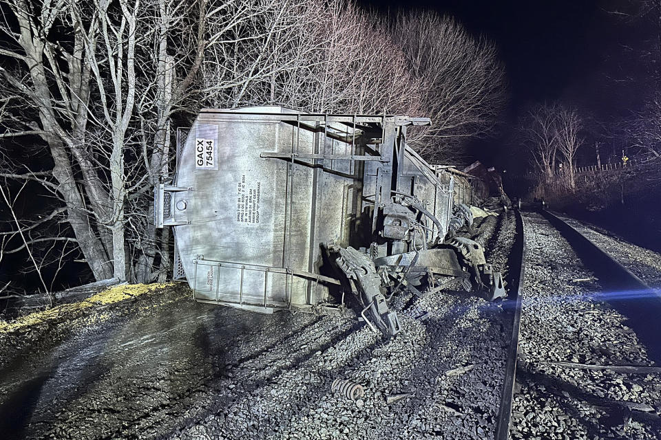 In this image provided by New York State Department of Environmental Conservation, train cars lie on their sides after a train derailed, Wednesday evening, Feb. 7, 2024, in Valley Falls, N.Y. Authorities say 10 cars of a 94-car cargo train carrying plastic pellets and cooking oil, derailed in upstate New York, with two ending up in a river. (Basil Seggos/ New York State Department of Environmental Conservation via AP)